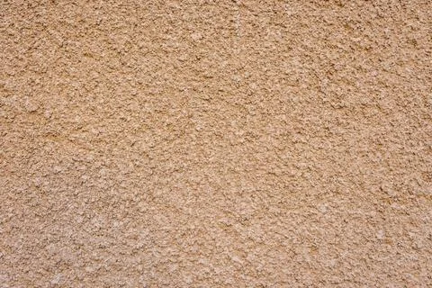 Orange-colored bumpy spotted rough wall texture 스톡 사진