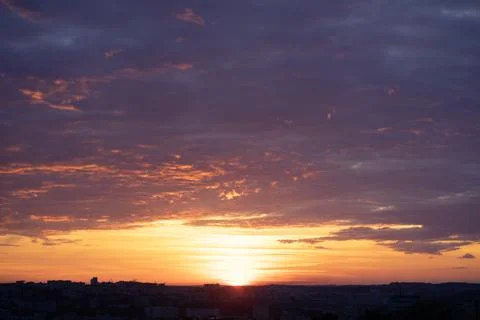 Orange colored dramatic sunset sky. Natural background Stock Photos