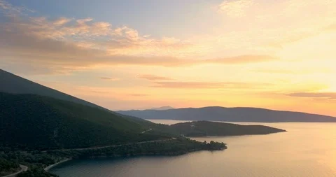 Orange colored sunset over the coastline Stock Footage 107969414