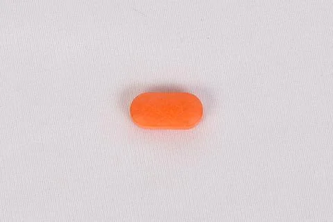 An orange colour tablet Stock Photos