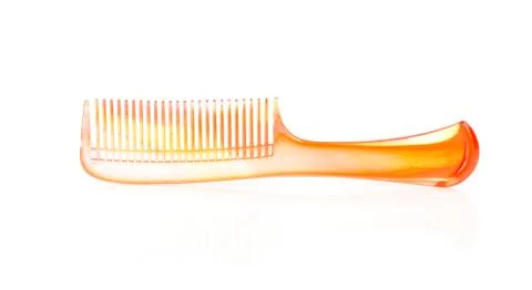 Orange comb isolated on white background. Stock Photos