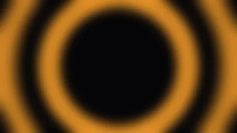 Orange concentric circles pulse and expand with soft light on black backgro.. Stock Footage 340941886