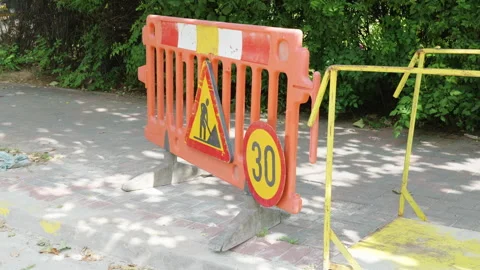 Orange construction barrier with warning sign and speed limit indicator Stock Footage 340273873