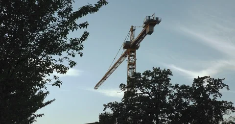 An orange construction crane in Uppsala crowded with birds Stock-Footage 95020804