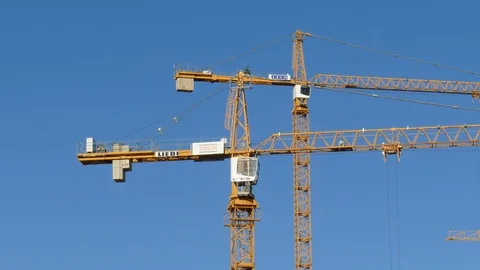Orange construction cranes, Blue sky, Bremen, Germany, Europe Stock Footage 124253056