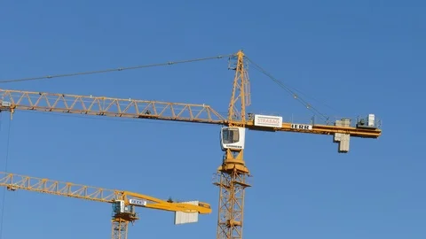Orange construction cranes, Blue sky, Bremen, Germany, Europe Stock Footage 124253125