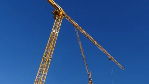 Orange construction cranes, Blue sky, Bremen, Germany, Europe Stock Footage 124254875