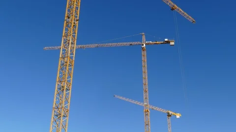 Orange construction cranes, Blue sky, Bremen, Germany, Europe Stock Footage 124254935