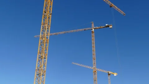 Orange construction cranes, Blue sky, Bremen, Germany, Europe Stock Footage 124255021