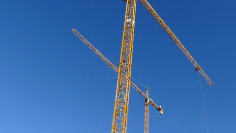 Orange construction cranes, Blue sky, Bremen, Germany, Europe Stock Footage 124255150