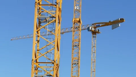 Orange construction cranes, Blue sky, Bremen, Germany, Europe Stock Footage 124255171