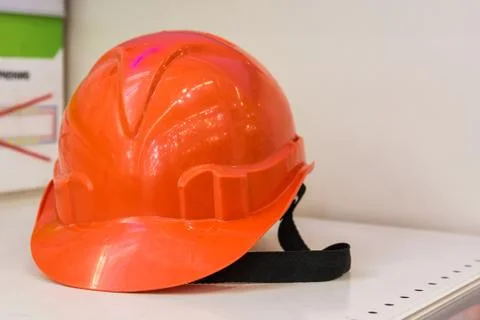 Orange construction helmet Stock Photos