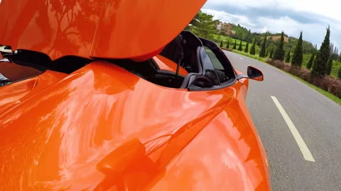 Orange convertible on the road Stock Footage 139851730