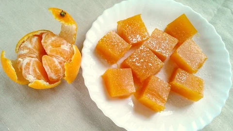 Orange cubes of marmalade Stock Footage 82849483
