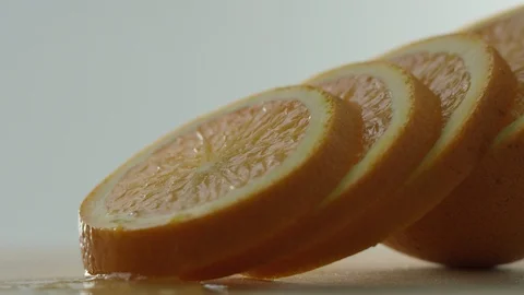 The orange is cut into circles, orange circles lie one after another, background Stock Footage 108555446