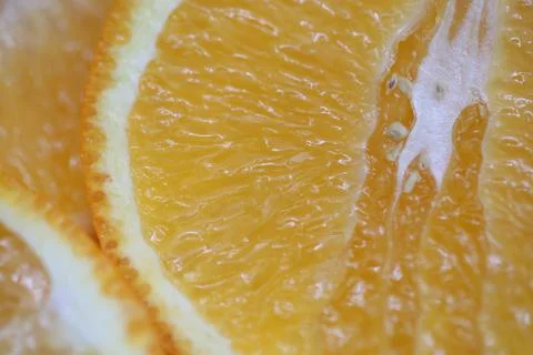 An orange cut in half in close-up macro Stock Photos