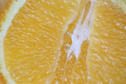 An orange cut in half in close-up macro Stock Photos