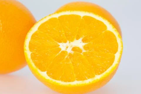 An orange cut in half Stock Photos
