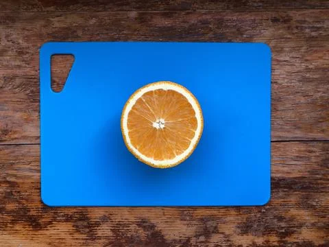 Orange on a cutting board Stock Photos
