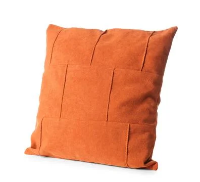 Orange decorative throw pillow with patchwork design, soft fabric cushion for Stock Photos