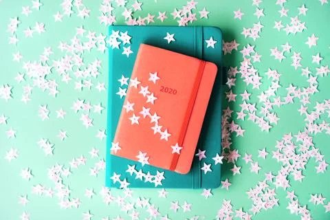 Orange diary for 2020 on a mint background. New Year concept in trendy colors. Stock Photos