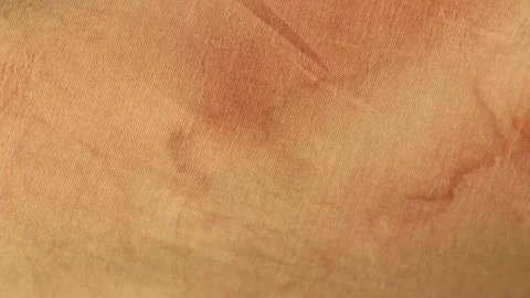 Orange dirty fabric with stains as a background Stock Footage 272258045
