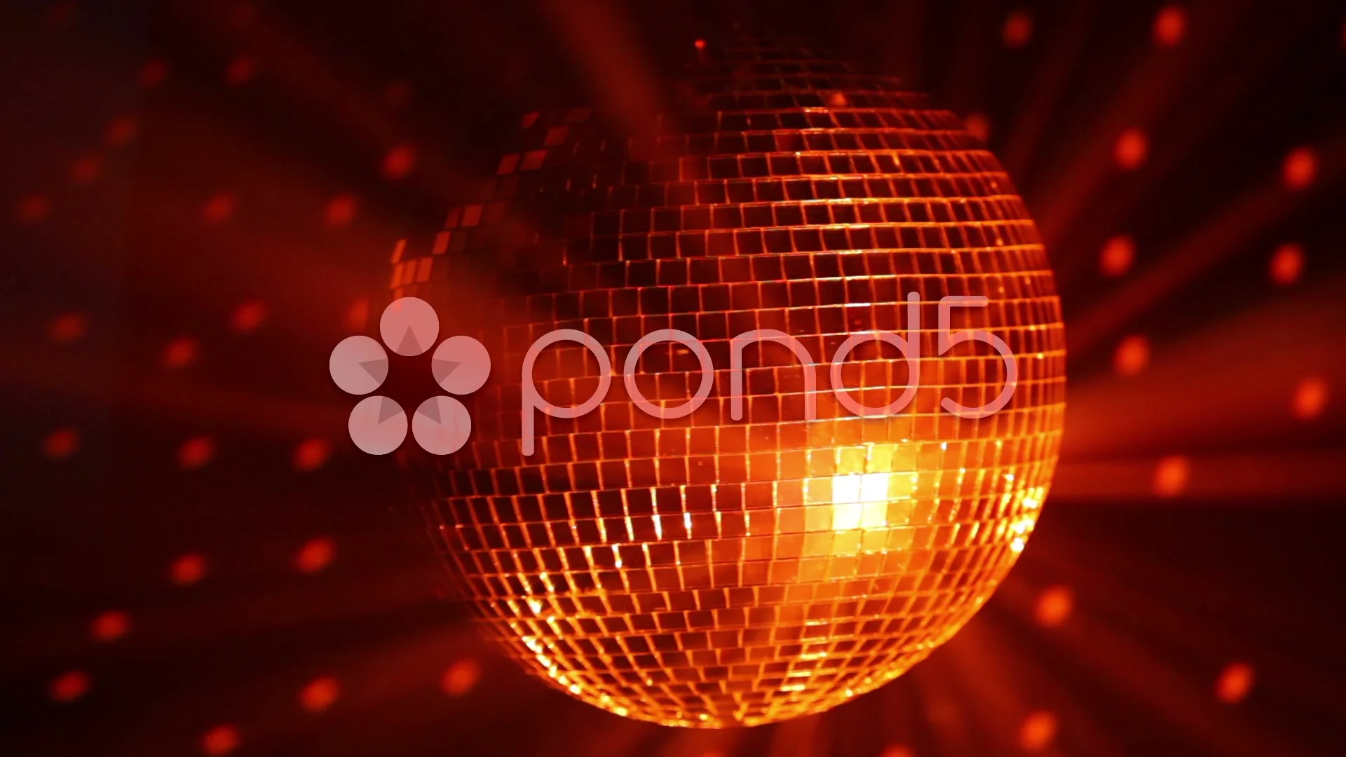 Closeup of mini disco balls under red and orange lights with a blurry  background Stock Photo by wirestock