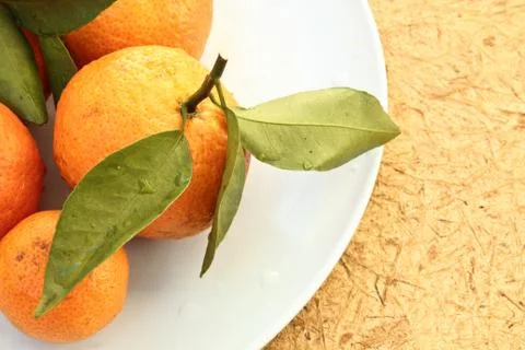 Orange on dish Foto stock