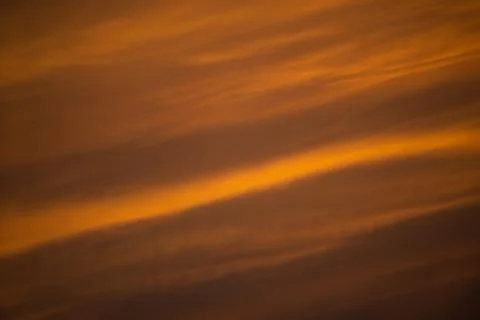 Orange dramatic sky at sunset. Stock Photos