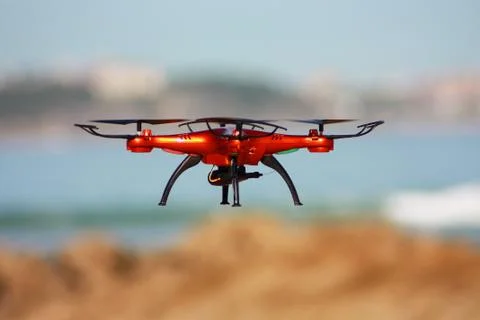 Orange drone on the beach Stock Photos