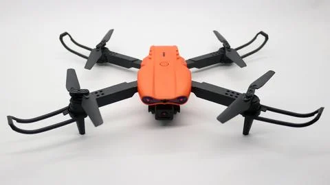 Orange drone with camera Stock Photos