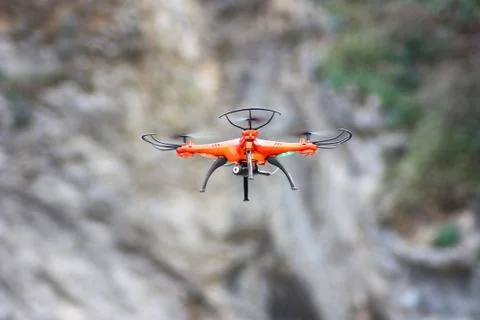 Orange drone flying Stock Photos