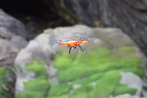 Orange drone flying Stock Photos