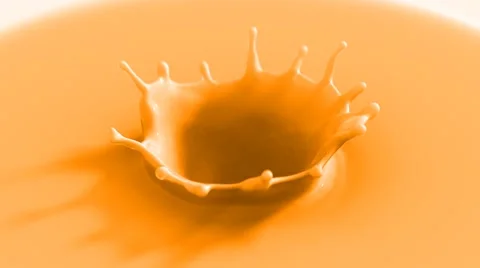 Orange drop falling in slow motion making beautiful crown splash Stock Footage 61653424