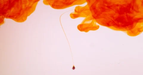 Orange drop in water Stock Footage 129758314