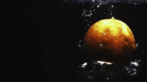 Orange Drops Creating an Explosion of Bubbles Stock Footage 300886519