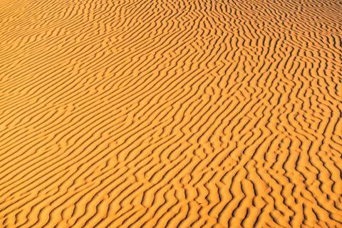 Orange dune waves pattern background of Sahara Desert, Merzouga, Morocco, Afr Foto stock