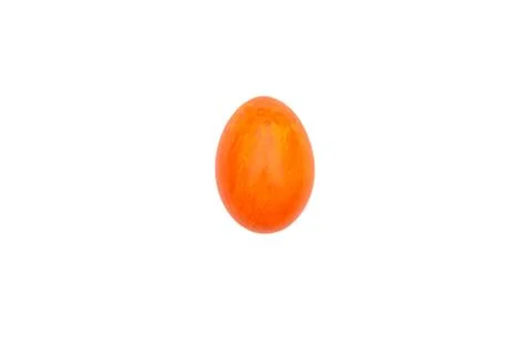 Orange egg on a white background. Painted egg painted. Traditional symbol and Foto stock
