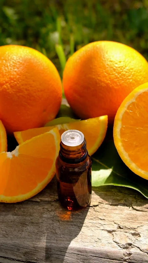 Orange essential oil in a bottle. Selective focus. Stock Footage 313122392
