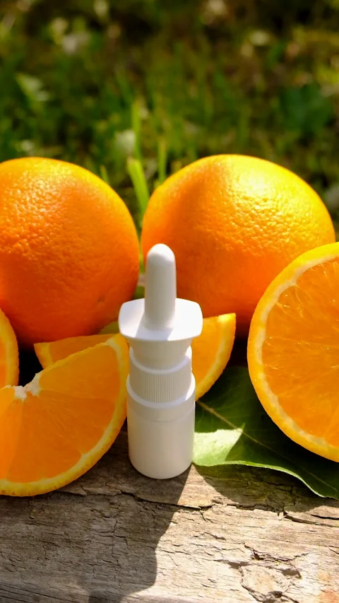 Orange essential oil in a bottle. Selective focus. Stock Footage 314222416
