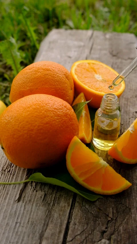 Orange essential oil in a bottle. Selective focus. Stock Footage 315339561