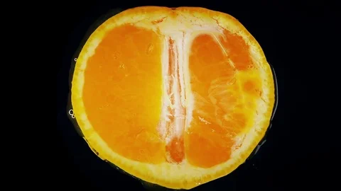 Orange exploding with healthy nutritious juice. Healthy food background Stock Footage 83434088