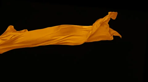 Orange fabric flowing on black background, Slow Motion Video stock 31819736