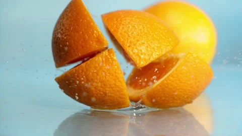 Orange fall into the water on  background Super slow-mo 1000 fps Stock Footage 163960428
