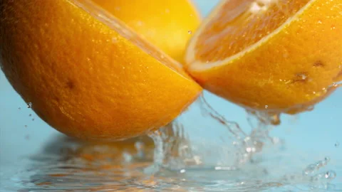 Orange fall into the water on  background Super slow-mo 1000 fps Stock Footage 163960473