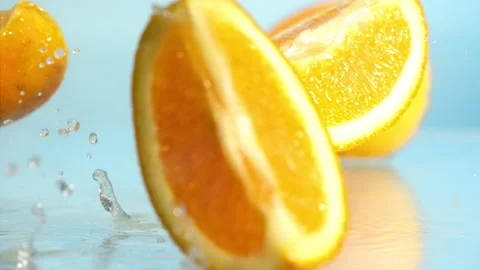 Orange fall into the water on  background Super slow-mo 1000 fps Stock Footage 163960679