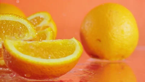 Orange fall into the water on  background Super slow-mo 1000 fps Stock Footage 163960876