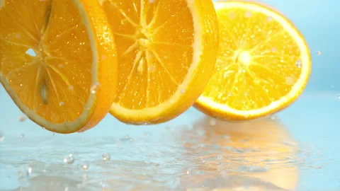 Orange fall into the water on  background Super slow-mo 1000 fps Stock Footage 163960889