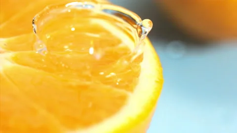 Orange fall into the water on  background Super slow-mo 1000 fps Stock Footage 163961166