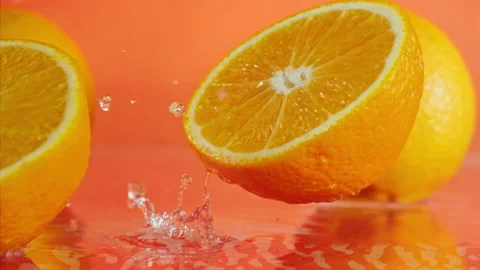 Orange fall into the water on  background Super slow-mo 1000 fps Stock Footage 163961503